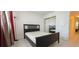 The bright bedroom has a closet, natural light, and neutral colors at 1504 Virginia Ave # 105, Daytona Beach, FL 32114