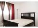 This bedroom features soft natural light and a simple, modern decor at 1504 Virginia Ave # 105, Daytona Beach, FL 32114