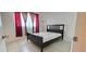 The bright bedroom has a closet, natural light, and neutral colors at 1504 Virginia Ave # 105, Daytona Beach, FL 32114