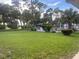 Enjoy lush lawns and mature trees with a view of the pool in this serene outdoor setting at 1504 Virginia Ave # 105, Daytona Beach, FL 32114