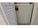A compact, white laundry unit is tucked behind a shuttered closet door, offering convenience at 1504 Virginia Ave # 105, Daytona Beach, FL 32114