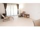 Bright living room featuring neutral tile flooring and comfortable seating at 1504 Virginia Ave # 105, Daytona Beach, FL 32114