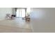 Living room featuring tile flooring, sliding glass doors to the outside, and comfortable seating at 1504 Virginia Ave # 105, Daytona Beach, FL 32114