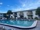 Enjoy the beautiful community pool with ample seating and views of the condominium at 1504 Virginia Ave # 105, Daytona Beach, FL 32114