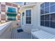 Outdoor balcony with a small table and chairs, offering a cozy and private outdoor space at 1521 Chatfield Pl, Orlando, FL 32814