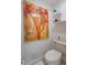 This half bath offers decor shelves and modern fixtures at 1521 Chatfield Pl, Orlando, FL 32814