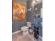 Elegant powder room featuring a modern glass vessel sink and stylish lighting fixtures at 1521 Chatfield Pl, Orlando, FL 32814