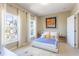 Comfortable bedroom with large windows, white curtains and a modern door perfect for relaxing in peace at 1521 Chatfield Pl, Orlando, FL 32814
