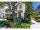 Beautiful townhome facade with lush greenery and a well-manicured lawn at 1521 Chatfield Pl, Orlando, FL 32814