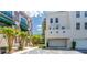 Townhouse exterior with a private two-car garage and manicured landscaping at 1521 Chatfield Pl, Orlando, FL 32814