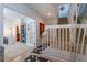 View of the hallway, stairs, and office area, featuring white trim and neutral decor at 1521 Chatfield Pl, Orlando, FL 32814