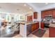 Open-concept kitchen boasts granite counters, stainless appliances, and overlooks the spacious living area at 1521 Chatfield Pl, Orlando, FL 32814