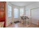 Bright kitchen/breakfast nook with large windows, tiled floors, and a table with barstool seating at 1521 Chatfield Pl, Orlando, FL 32814