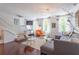 Bright open living room with modern lighting, sofa, and hardwood floors at 1521 Chatfield Pl, Orlando, FL 32814