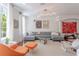 Open living area featuring a comfortable sofa, modern lighting, and windows at 1521 Chatfield Pl, Orlando, FL 32814