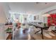 Open living area with hardwood floors, modern furniture, and a dining area at 1521 Chatfield Pl, Orlando, FL 32814