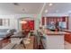 Open layout combining dining, kitchen, and living area with hardwood floors at 1521 Chatfield Pl, Orlando, FL 32814