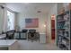 Bright office with two desks, an American flag art piece, and gray shelving at 1521 Chatfield Pl, Orlando, FL 32814