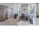 Bright office featuring a glass door, two windows, and two workstations at 1521 Chatfield Pl, Orlando, FL 32814