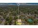 An aerial view highlights the home's location within a lush neighborhood, surrounded by mature trees at 1531 Huntington St, Lakeland, FL 33801