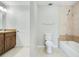 Tiled bathroom featuring a shower-tub combo, toilet, and vanity with a sink at 1531 Huntington St, Lakeland, FL 33801