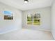 Bright bedroom with two windows showing backyard at 1531 Huntington St, Lakeland, FL 33801