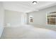 Bright bedroom with carpeted floors and natural light from two large windows at 1531 Huntington St, Lakeland, FL 33801