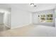 Cozy living room featuring carpet and large window to view the front yard at 1531 Huntington St, Lakeland, FL 33801