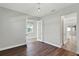 Bedroom with hardwood floors, french doors, and neutral paint at 15975 Marina Bay Dr, Winter Garden, FL 34787