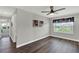 Inviting bedroom features wood flooring, a modern ceiling fan, and a bright window at 15975 Marina Bay Dr, Winter Garden, FL 34787