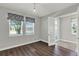 Bedroom with hardwood floors, french doors, and neutral paint at 15975 Marina Bay Dr, Winter Garden, FL 34787
