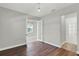 Bedroom with hardwood floors, french doors, and neutral paint at 15975 Marina Bay Dr, Winter Garden, FL 34787