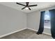 A bright bedroom featuring a ceiling fan and one window at 15975 Marina Bay Dr, Winter Garden, FL 34787