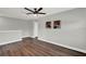 The bonus room features sleek flooring and is a versatile space for a home office, gym, or play area at 15975 Marina Bay Dr, Winter Garden, FL 34787