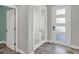Inviting entryway with tile floors, featuring a stylish front door and elegant French doors at 15975 Marina Bay Dr, Winter Garden, FL 34787