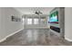 Comfortable living space with a fireplace, gray walls, and a ceiling fan at 15975 Marina Bay Dr, Winter Garden, FL 34787