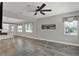 Open layout living room with large windows and neutral paint for natural light at 15975 Marina Bay Dr, Winter Garden, FL 34787