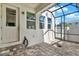The covered patio includes stylish pavers and opens to the backyard at 15975 Marina Bay Dr, Winter Garden, FL 34787