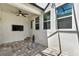 The covered patio includes stylish pavers, a ceiling fan, and a television at 15975 Marina Bay Dr, Winter Garden, FL 34787