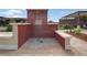 Community outdoor shower featuring a red brick enclosure, concrete accents, and brick floor at 15975 Marina Bay Dr, Winter Garden, FL 34787