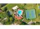 Aerial view of community amenities including pool, tennis court, and sand volleyball court at 1638 Whitney Isles Dr, Windermere, FL 34786