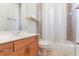 This bathroom features a tub with shower and a wooden vanity with ample storage at 1638 Whitney Isles Dr, Windermere, FL 34786