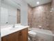 Bathroom features a bath tub with shower and wooden vanity with ample storage at 1638 Whitney Isles Dr, Windermere, FL 34786