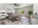 Well-lit bedroom features a ceiling fan, neutral colors, and a large sunny window at 1638 Whitney Isles Dr, Windermere, FL 34786