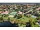 An aerial view of a large community area featuring a pool, clubhouse, and recreational facilities at 1638 Whitney Isles Dr, Windermere, FL 34786
