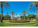 Picturesque community fountain surrounded by lush landscaping and palm trees at 1638 Whitney Isles Dr, Windermere, FL 34786