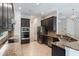 Open concept kitchen with granite countertops, stainless steel appliances, and stylish cabinetry at 1638 Whitney Isles Dr, Windermere, FL 34786