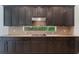 Updated kitchen with granite countertops, ample cabinetry, and a stainless steel range hood at 1638 Whitney Isles Dr, Windermere, FL 34786