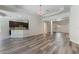Open-concept living area with hardwood floors and view into the kitchen and adjacent rooms at 1638 Whitney Isles Dr, Windermere, FL 34786