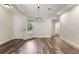 Bright living room featuring wood floors, neutral paint and a decorative light fixture at 1638 Whitney Isles Dr, Windermere, FL 34786